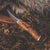Roselli's Finnish handmade hunting knife in model "opening knife" with a handle made out of stained curly birch and details of silver ferrule.