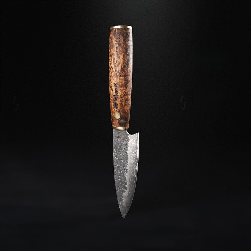 Handmade allround kitchen knife made from Damascus steel. Comes with a handmade leather sheath made from Finnish leather. 