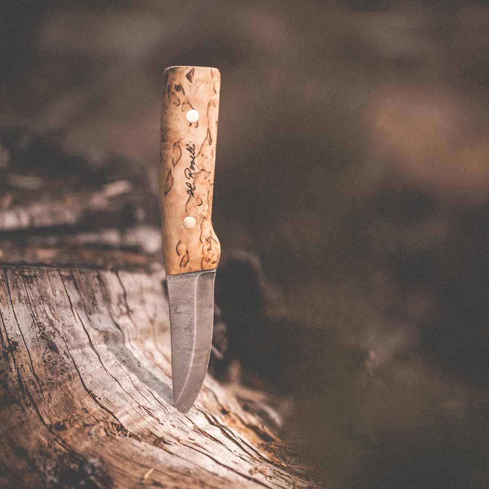 Handmade Finnish hunting knife with a full tang blade and a handle made out of curly birch 
